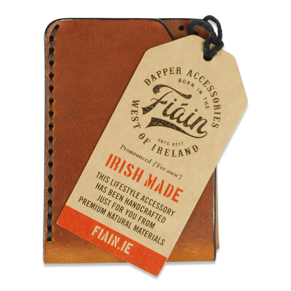 Front view with hang tag of chestnut brogue leather card wallet by Fiain